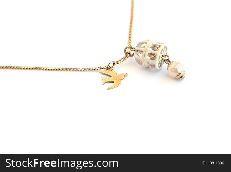 Necklace with bird and cage medallions isolated on white background.