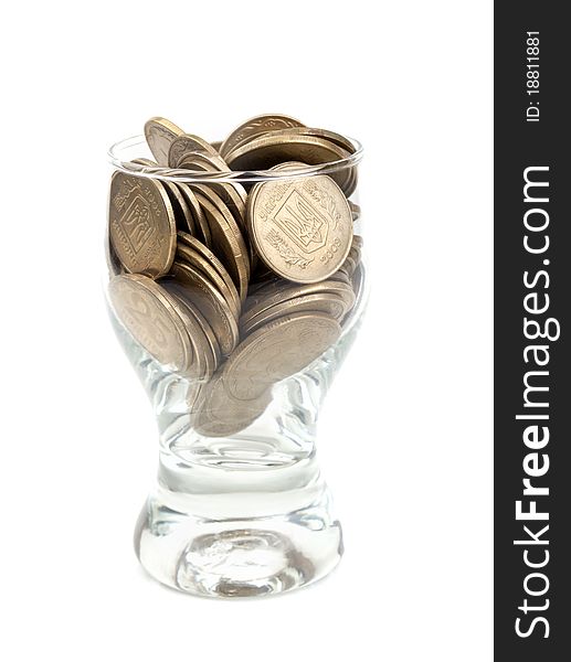 Coins in a glass isolated on a white background