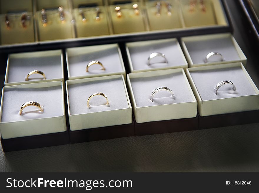 Golden rings in boxes in the store