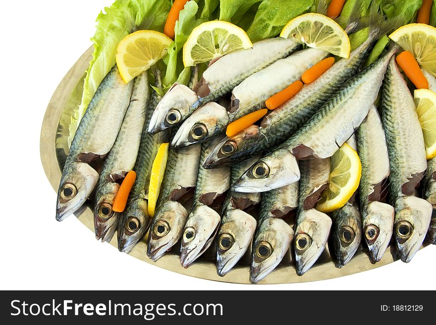 Fresh Fishes With Slices Of Lemons And Carrots