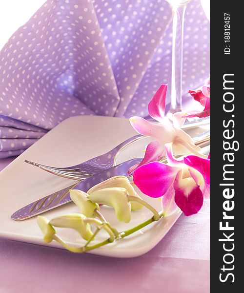 Table setting with flower and cutlery