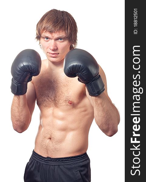 Young caucasian man boxer with black boxing gloves on white background. Studio shot. Young caucasian man boxer with black boxing gloves on white background. Studio shot.