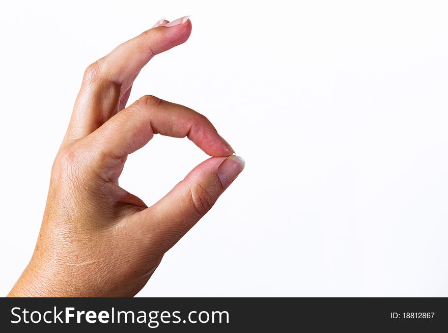 Hand making the okay sign on white background. Hand making the okay sign on white background.