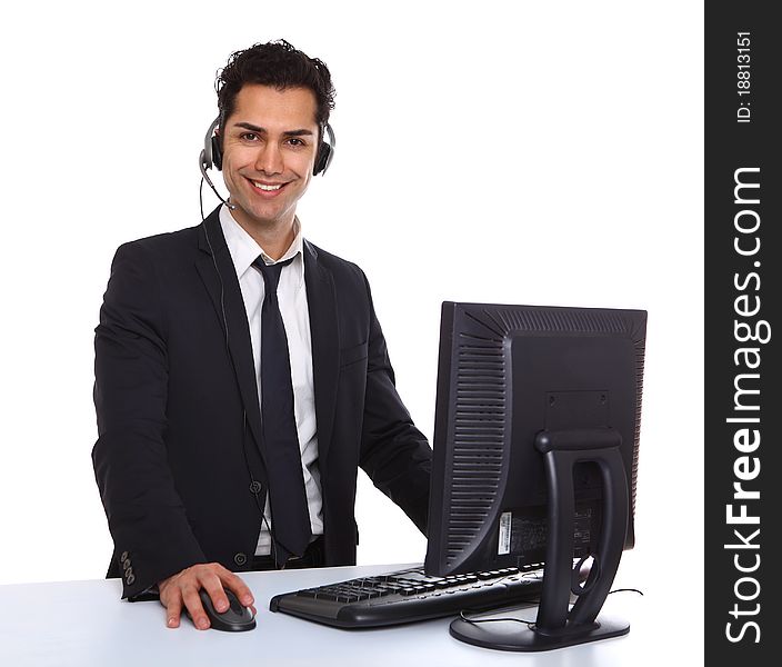Service with a smile male secretary near a computer. Service with a smile male secretary near a computer