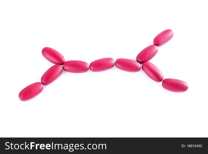 Macro of red pills isolated on white background