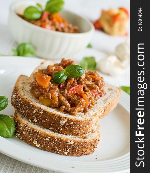 Sandwich of savory ground beef on toasted wholewheat bread. A delicious variety of a Sloppy Joe. Sandwich of savory ground beef on toasted wholewheat bread. A delicious variety of a Sloppy Joe.