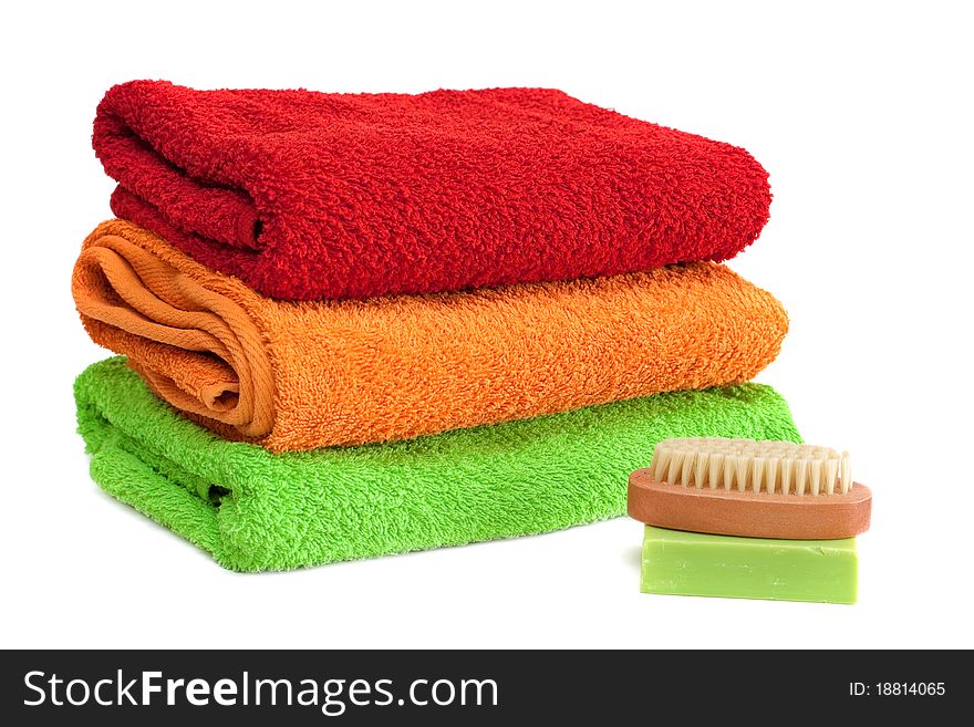 Stacked colorful towels isolated on a white background. Stacked colorful towels isolated on a white background.