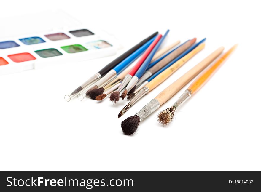 Paint brushes and watercolor isolated on a white background. Paint brushes and watercolor isolated on a white background.