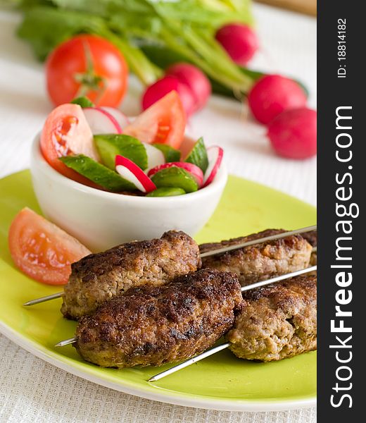 Minced meat kebab with fresh vegetable