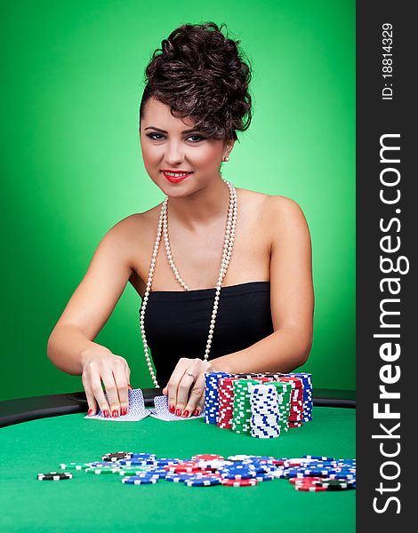 woman in dress dealing cards at poker table