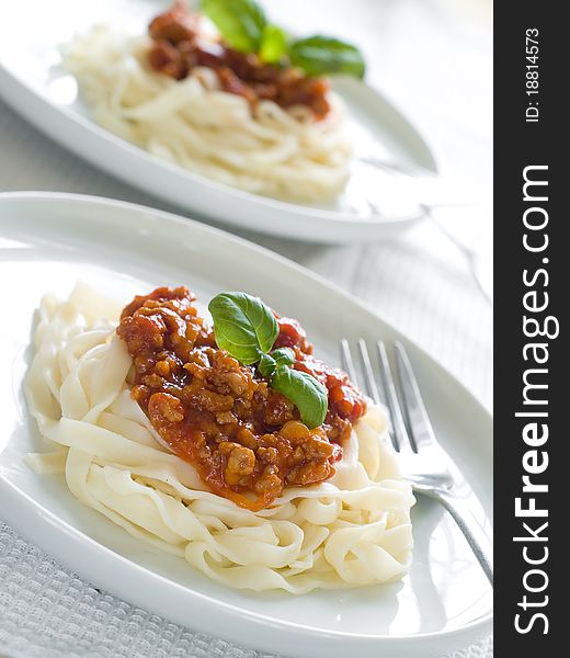 Pasta with bolognese sauce and basil