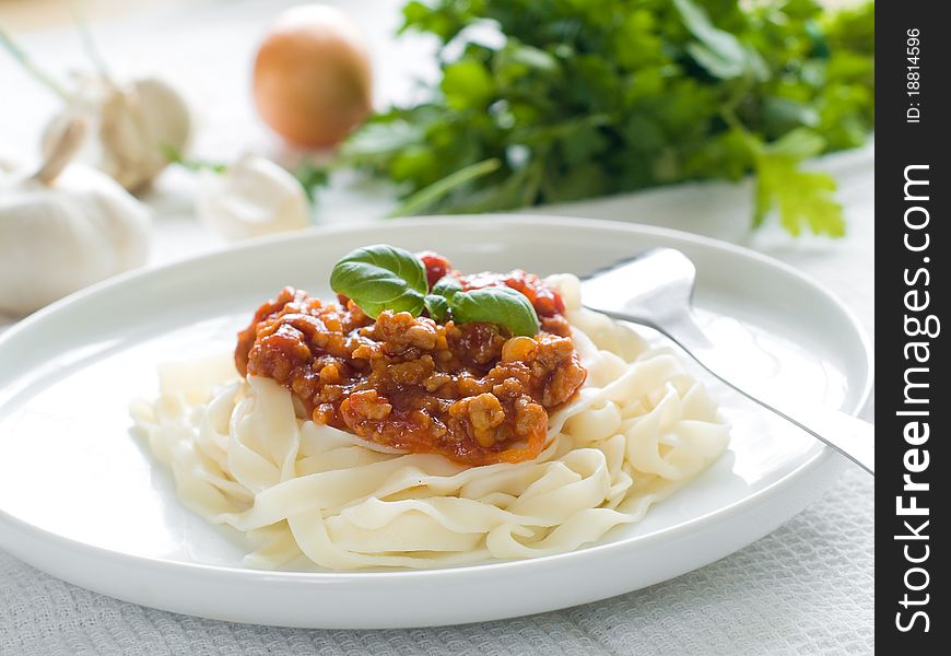 Pasta with bolognese sauce and basil