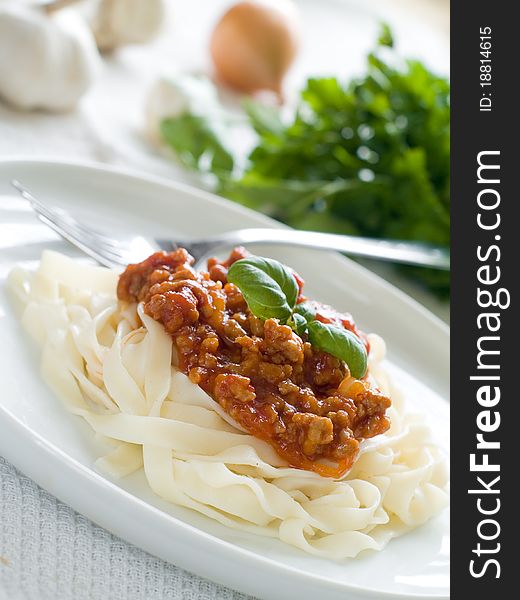 Pasta with bolognese sauce and basil