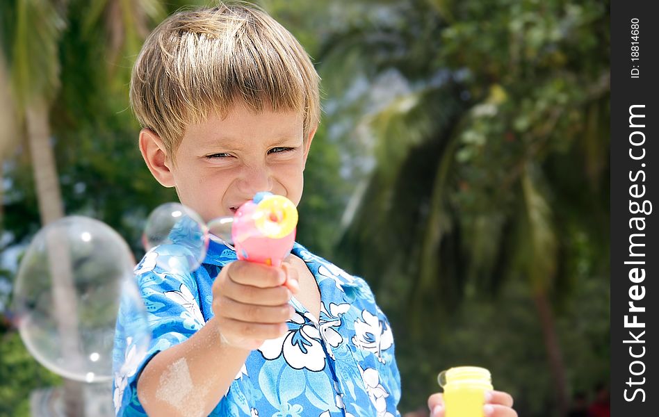 Young Boy Playing With Bubbles