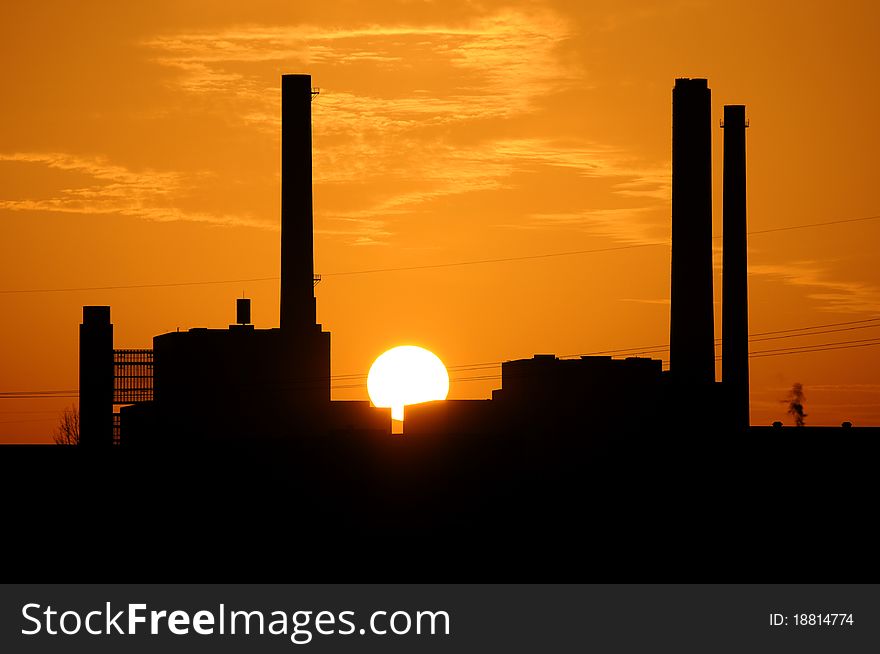 A power station at sunset. A power station at sunset.