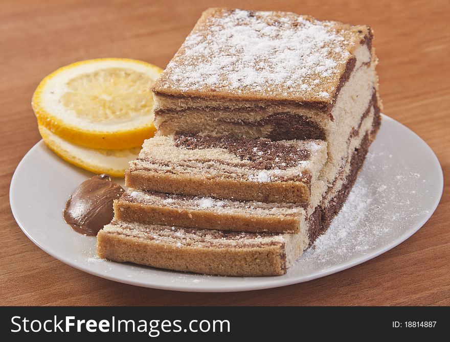 Sliced cake with orange and chocolate