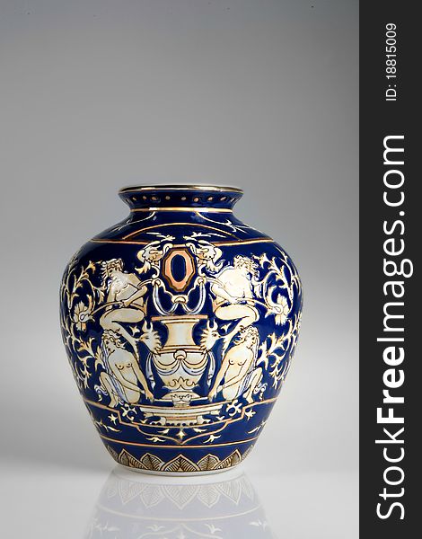 Blue porcelain vase with drawing of ancient figures. Blue porcelain vase with drawing of ancient figures