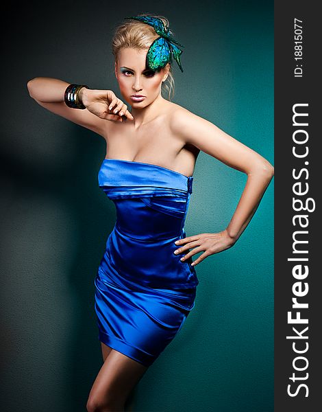 Elegant fashionable woman in blue dress