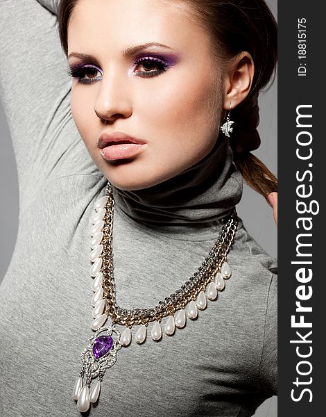 Elegant fashionable woman with violet visage