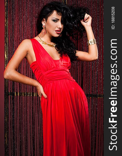 Elegant fashionable woman in red dress