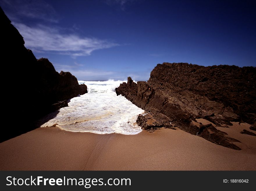 Wild sea and sandy beach with rocks. Wild sea and sandy beach with rocks