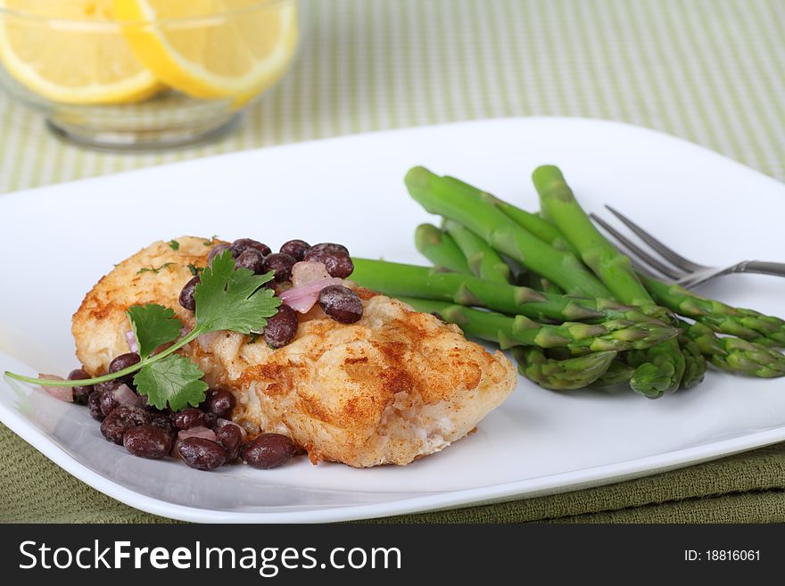 Fish fillet meal with asparagus and lemon slices