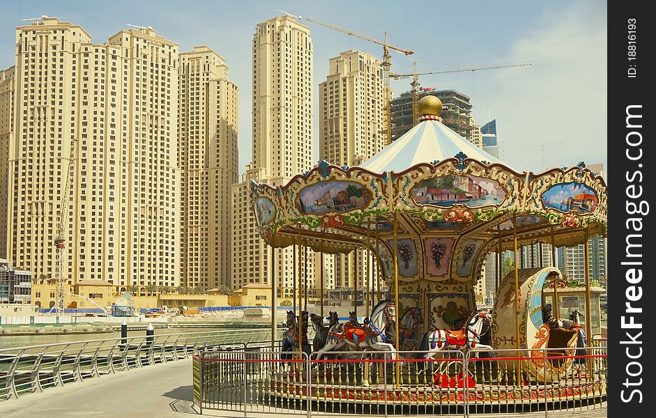 Vintage carousel in the modern city