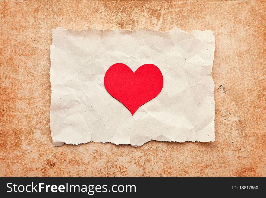 Ripped piece of paper on grunge paper background. vintage retro card. Valentine's Day