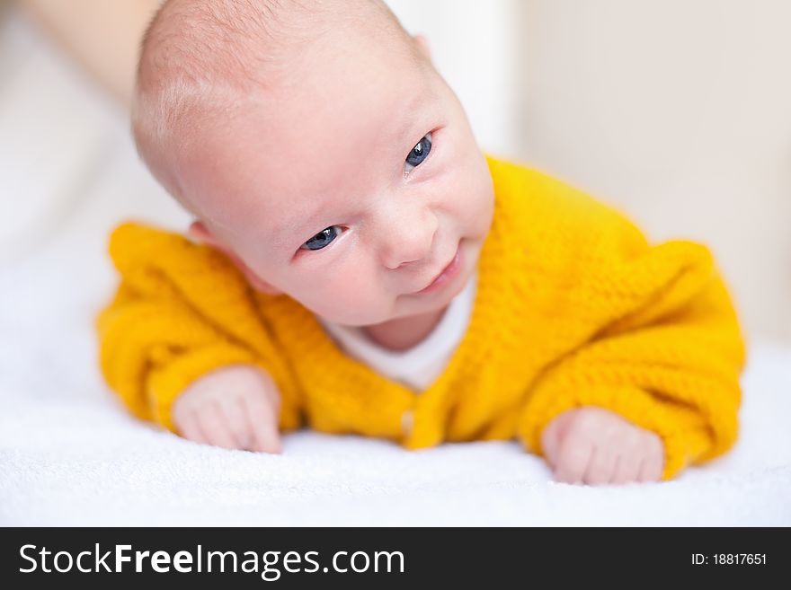 Newborn baby boy in yellow cloth