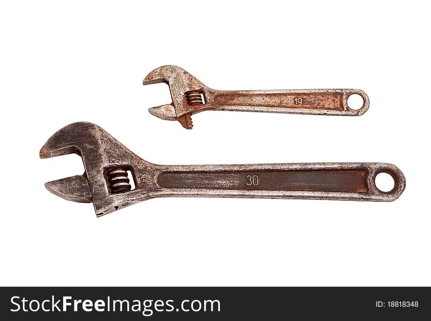 Old rusty wrench, isolated on white background