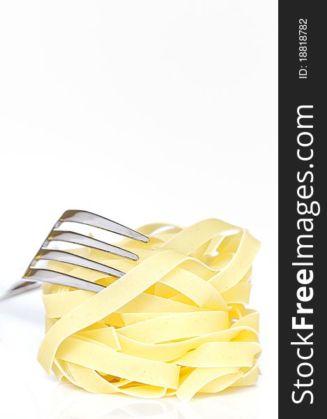 Pasta tagliatelle isolated on white in studio