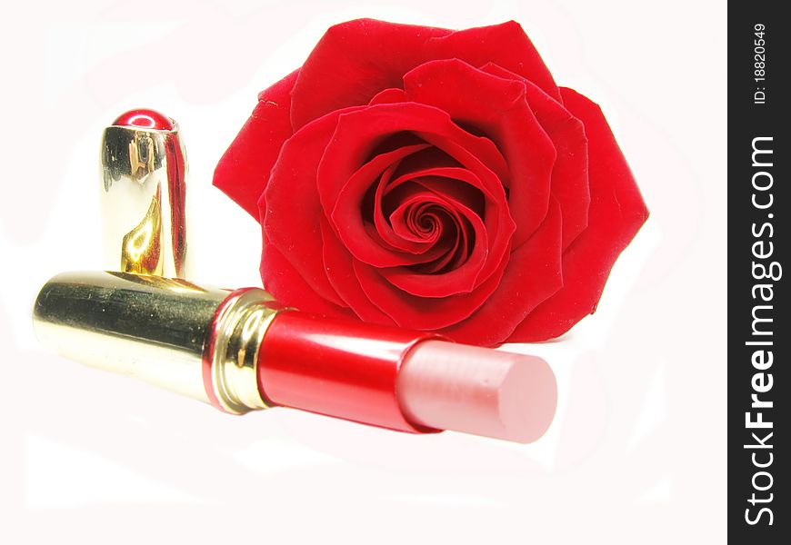 Red lipstick with rose on background