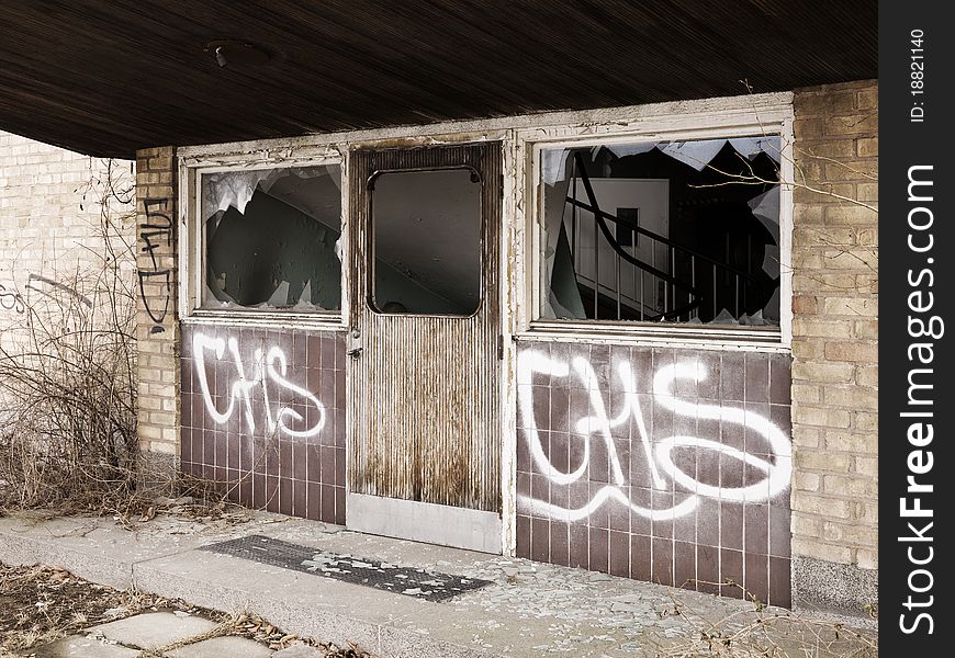 Ruined entrance on a brick wall building