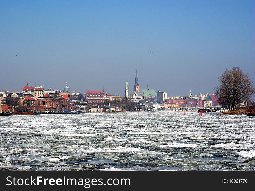 Ice float on river on city background