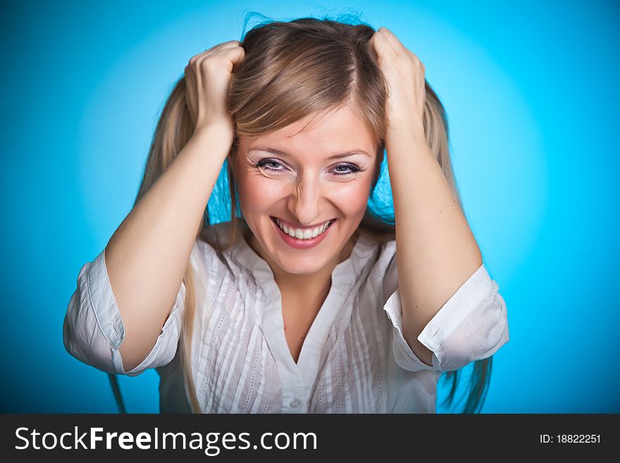 Angry woman on blue background