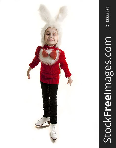 Girl in a cap of a bunny standing on the skates. Girl in a cap of a bunny standing on the skates