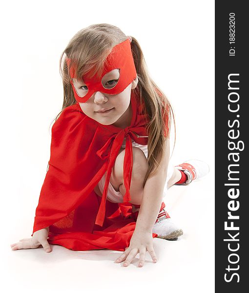 Superhero little girl in a red raincoat and a mask. Superhero little girl in a red raincoat and a mask