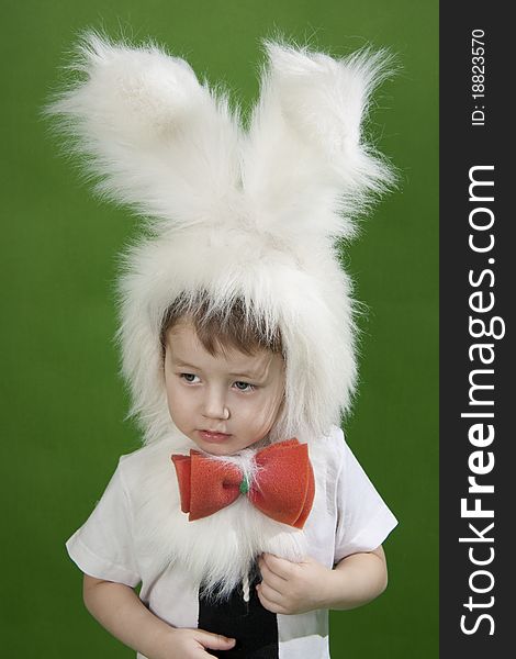 Boy in a white downy bunny costume. Boy in a white downy bunny costume.