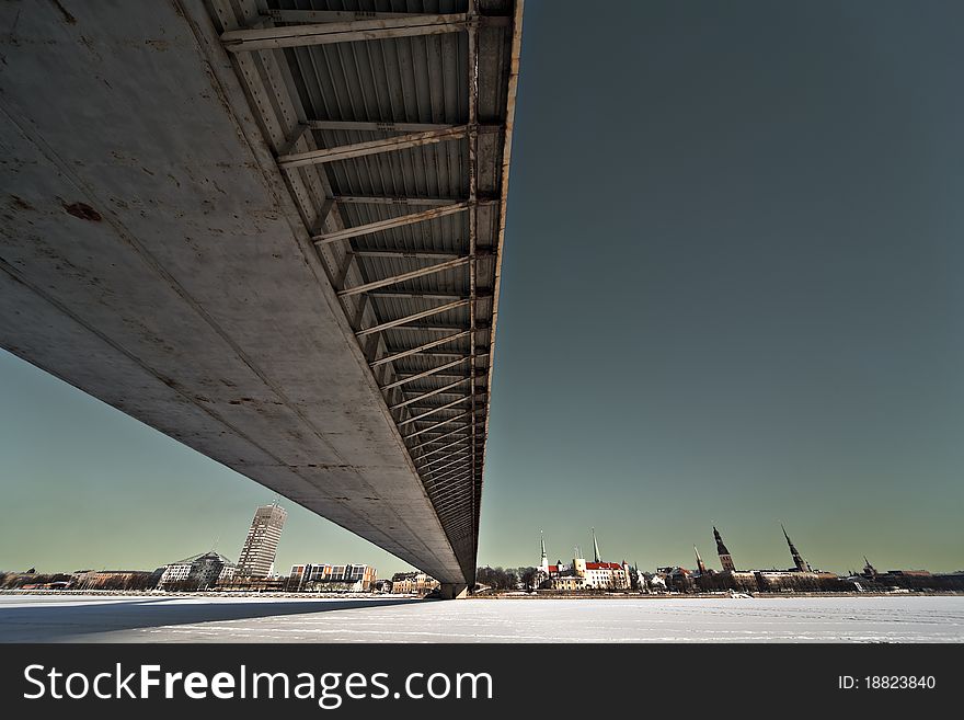 The wide angle view of the bridge over the city.