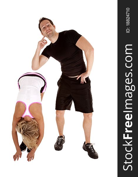 A woman bending and stretching while the man is going to lean on her back for support. A woman bending and stretching while the man is going to lean on her back for support.