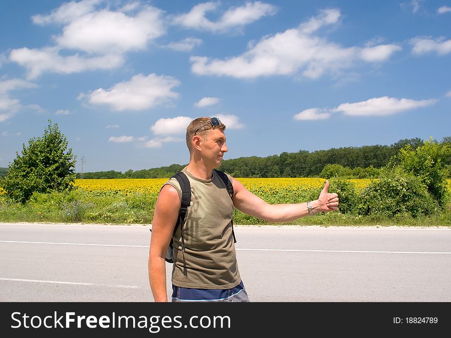 Man stops a cars on a roadside