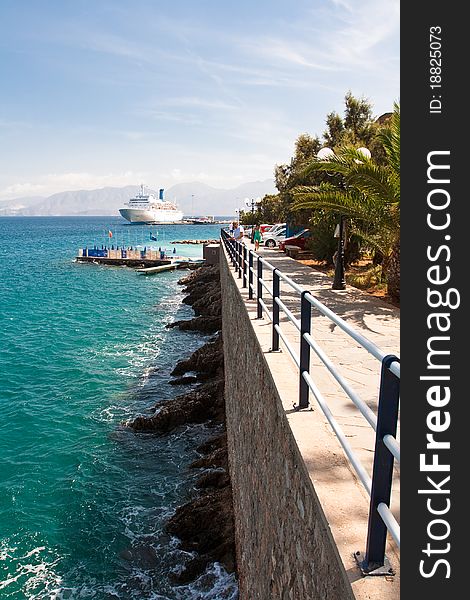 Agios Nicolaos - embankment & ferry at the pier. Agios Nicolaos - embankment & ferry at the pier