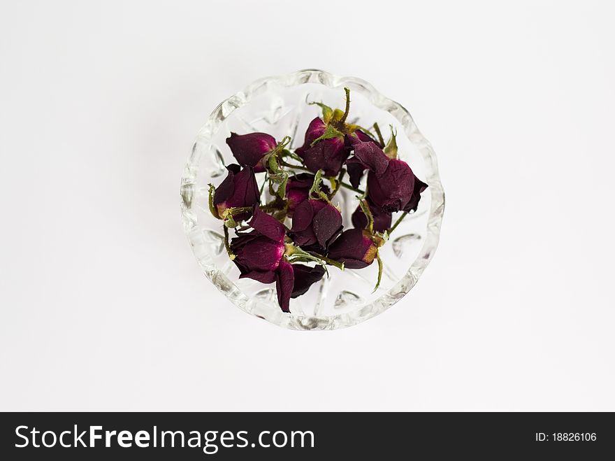 Red dried red roses, without stems,in the cristal bowl