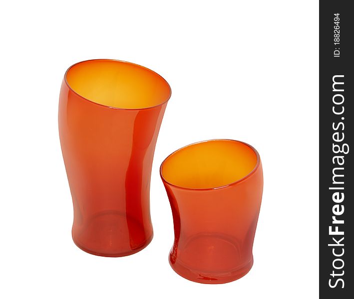 Two red empty glass cups unusual shape, isolated,. Two red empty glass cups unusual shape, isolated,