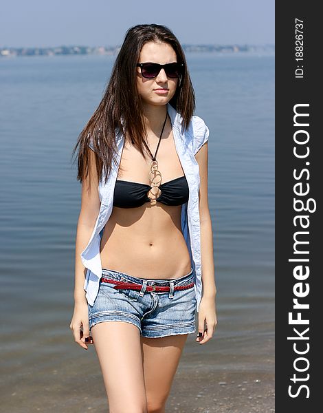 Pretty caucasian young woman on the beach. Pretty caucasian young woman on the beach