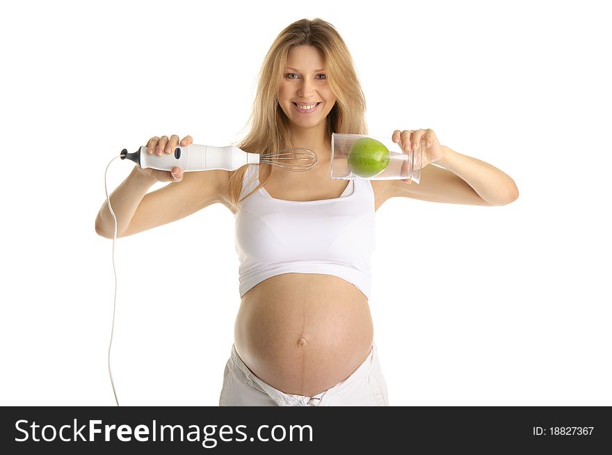 Pregnant woman with a blender and apple isolated on white