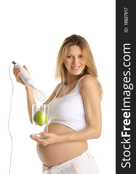 Pregnant Woman With A Blender And Apple