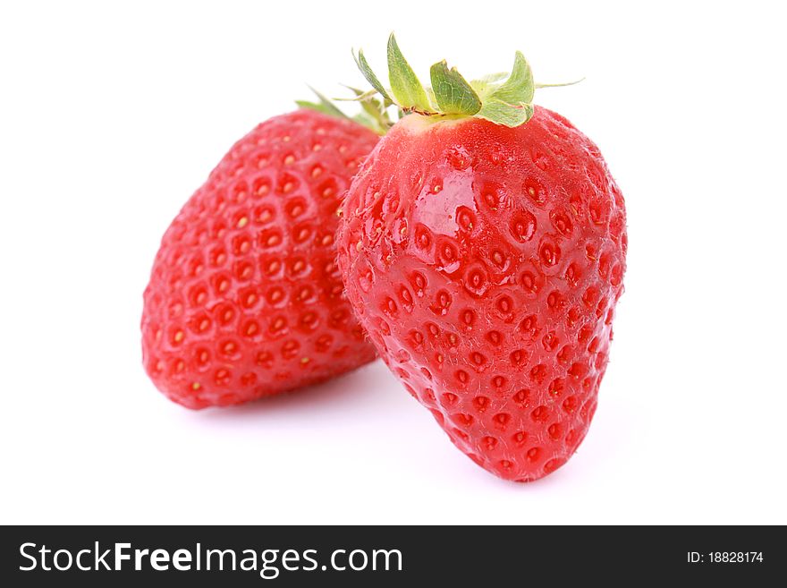 Two fresh strawberries isolated on white background. Two fresh strawberries isolated on white background.