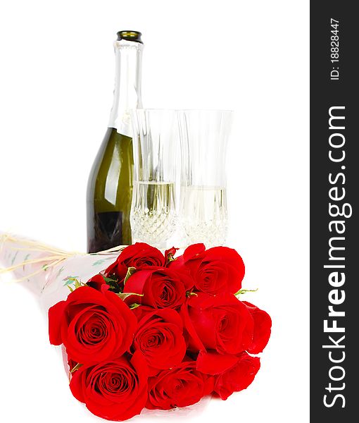 Champagne and roses for celebration of Valentines day with green bottle in background