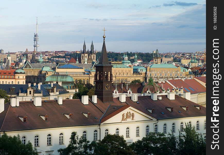 Urban landscape with a steeple in the foreground. Prague, Czech Republic